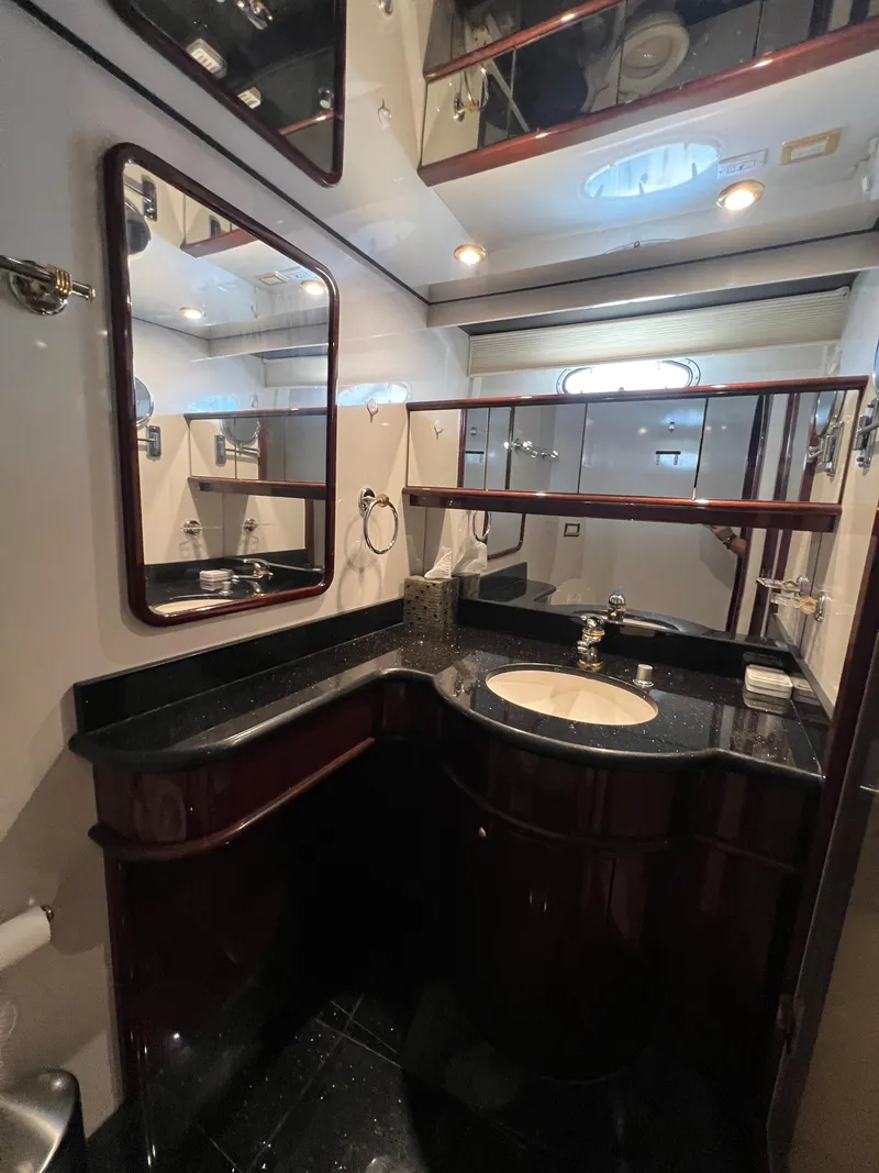 Slide: The Image of Luxurious bathroom in 2005 Neptunus 62 Flybridge yacht with elegant fixtures and mirrors. - 40