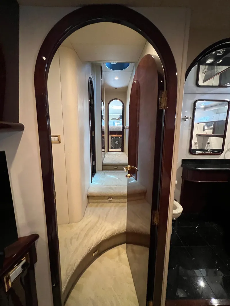 Slide: The Image of Interior hallway of 2005 Neptunus 62 Flybridge yacht with elegant wood finishes. - 42