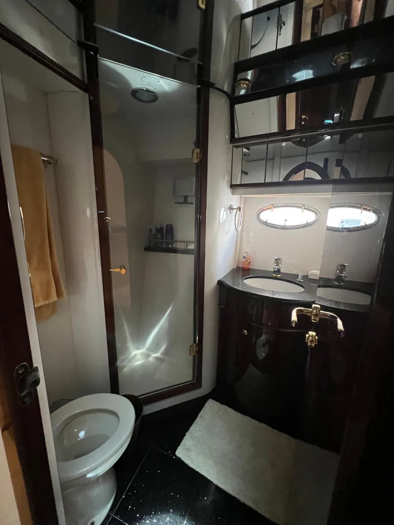 Slide: The Image of Luxurious bathroom in 2005 Neptunus 62 Flybridge yacht with modern fixtures. - 44
