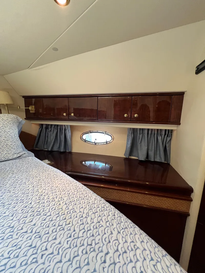 Slide: The Image of Luxurious cabin interior of 2005 Neptunus 62 Flybridge yacht with wood cabinetry. - 48