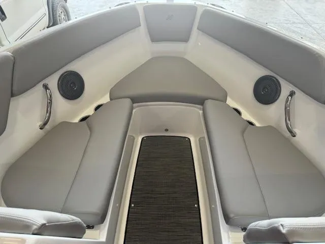 Slide: The Image of 2025 Four Winns H1 boat interior with gray seating and speakers. - 11