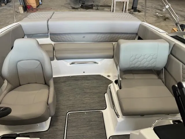 Slide: The Image of 2025 Four Winns H1 boat interior with gray seating and modern design. - 12