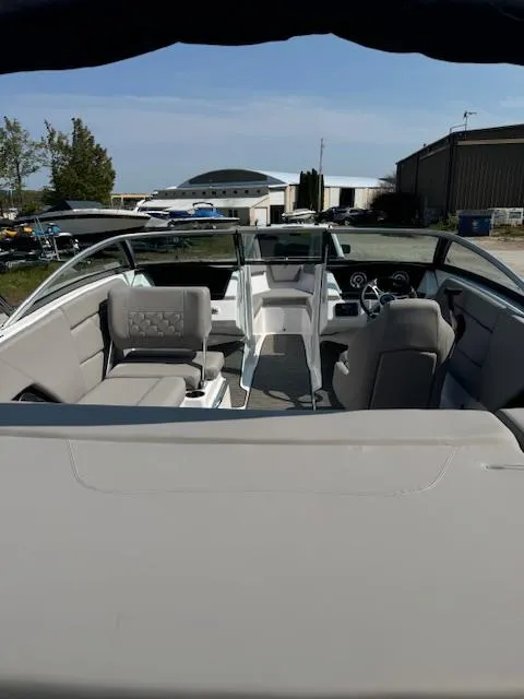 Slide: The Image of 2025 Four Winns H1 boat interior with modern seating and dashboard. - 13