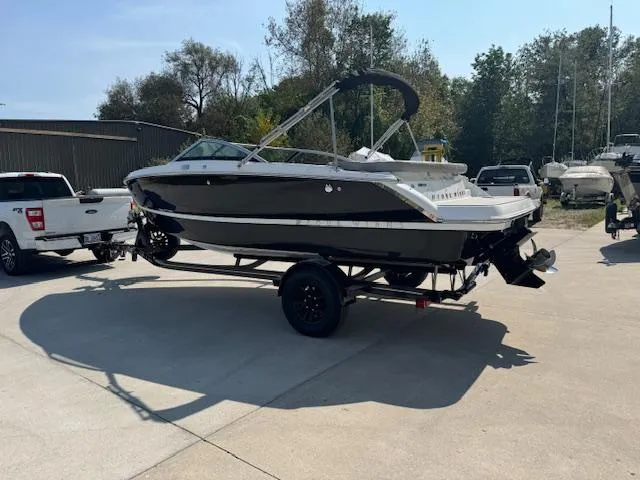 Slide: The Image of 2025 Four Winns H1 boat on trailer in outdoor setting. - 4