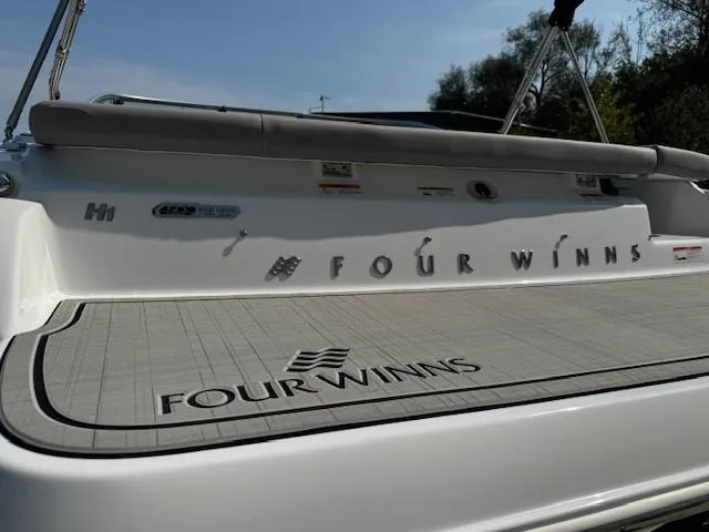 Slide: The Image of 2025 Four Winns H1 boat deck with logo and branding. - 6