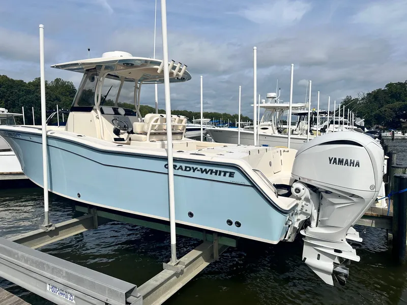 Slide: The Image of 2022 Grady-White Canyon 271 boat with Yamaha engine docked at marina. - 1