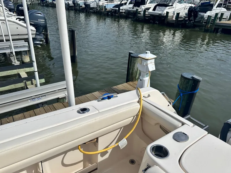 Slide: The Image of Grady-White Canyon 271 boat docked at marina, 2022 model. - 10