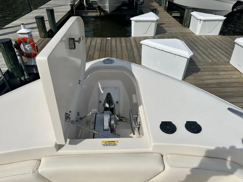 Slide: The Image of 2022 Grady-White Canyon 271 boat anchor compartment at dock. - 16