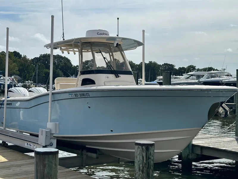 Slide: The Image of 2022 Grady-White Canyon 271 boat docked at marina. - 3