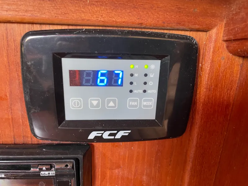 Slide: The Image of Digital control panel on 1992 Island Packet 32 sailboat displaying temperature. - 25