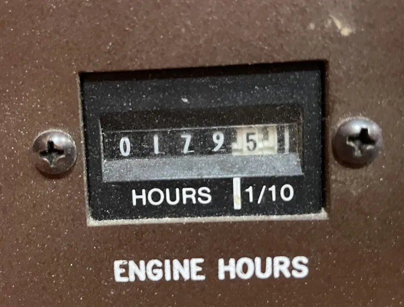 Slide: The Image of Engine hour meter showing 1795.1 hours on a 1992 Island Packet 32. - 37