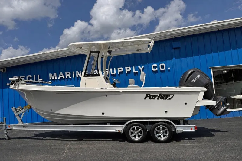 The Image of 2025 Parker 2200 Center Console boat on trailer at marine supply store. - 0