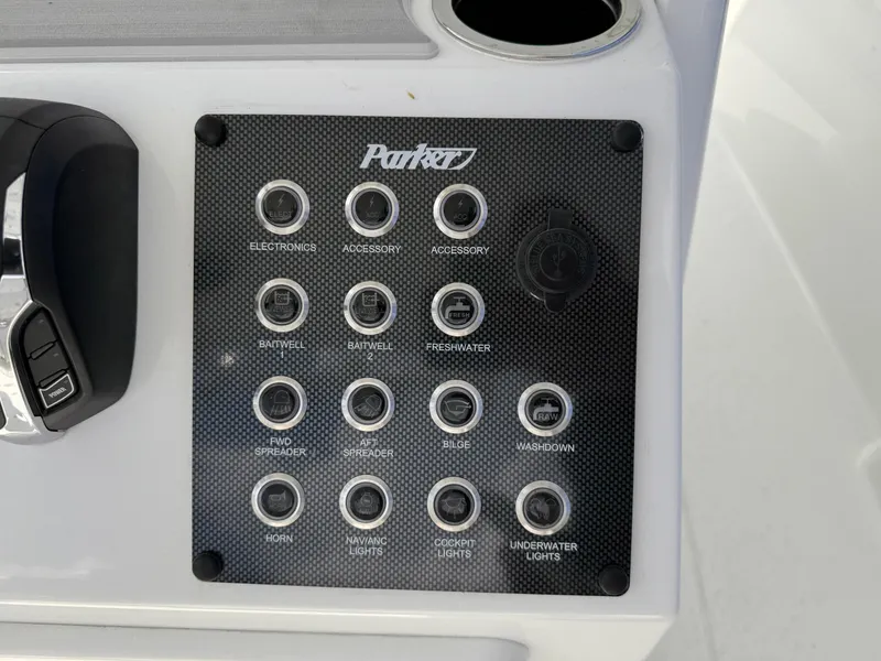 Slide: The Image of Control panel of 2025 Parker 2200 Center Console boat with labeled switches. - 13