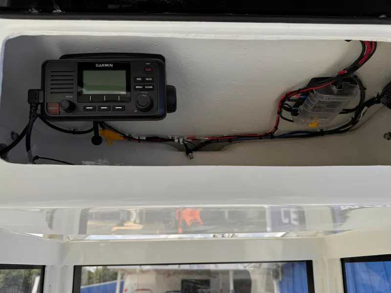 Slide: The Image of 2025 Parker 2200 Center Console boat interior with Garmin marine electronics. - 18