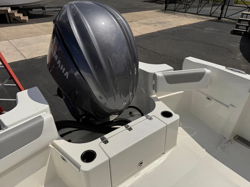 Slide: The Image of 2025 Parker 2200 Center Console boat with Yamaha outboard motor, docked outdoors. - 20