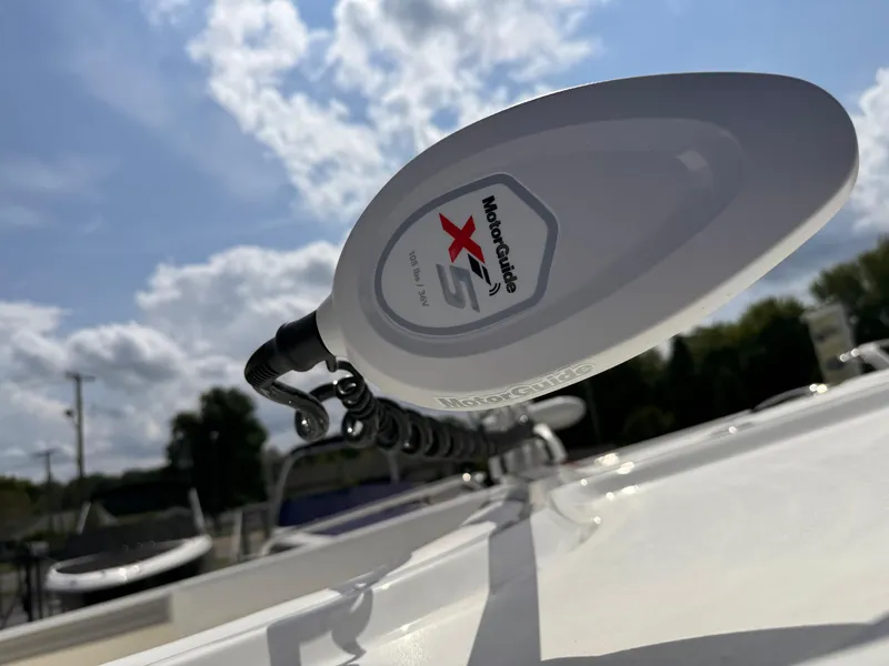 Slide: The Image of Close-up of MotorGuide X5 on 2025 Parker 2200 Center Console boat under a cloudy sky. - 24