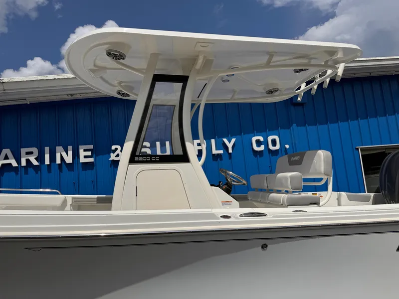 Slide: The Image of 2025 Parker 2200 Center Console boat with T-top, displayed outdoors. - 3