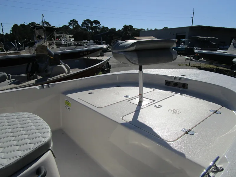 Slide: The Image of 2025 Carolina Skiff JLS Series 178JLS boat interior with seating and storage compartments. - 6