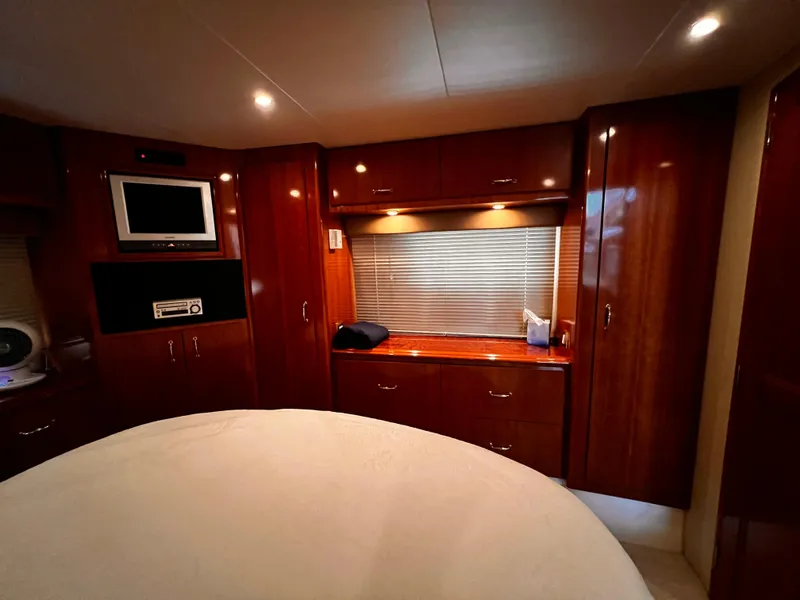 Slide: The Image of Luxurious interior of 2005 Carver 466 Motor Yacht with wood cabinetry and modern amenities. - 10