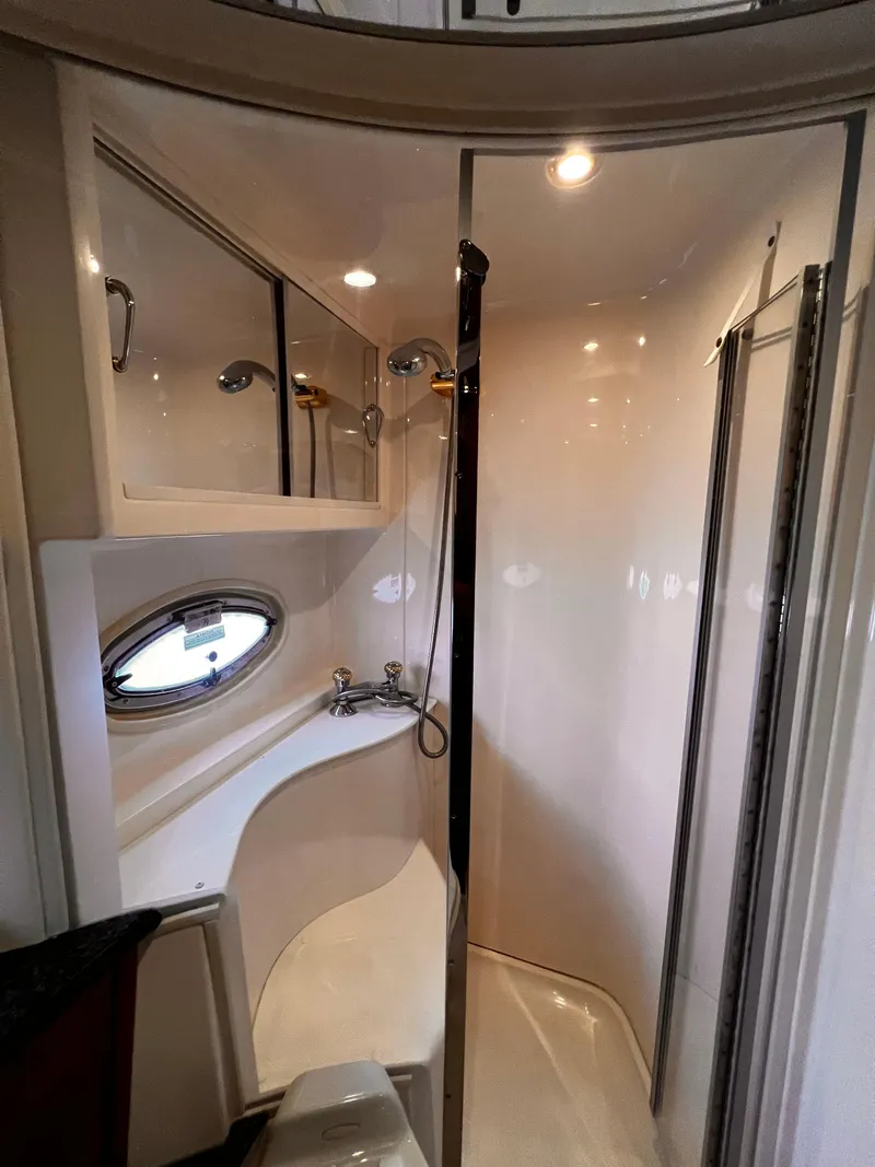 Slide: The Image of Luxurious bathroom in 2005 Carver 466 Motor Yacht with shower and porthole window. - 12