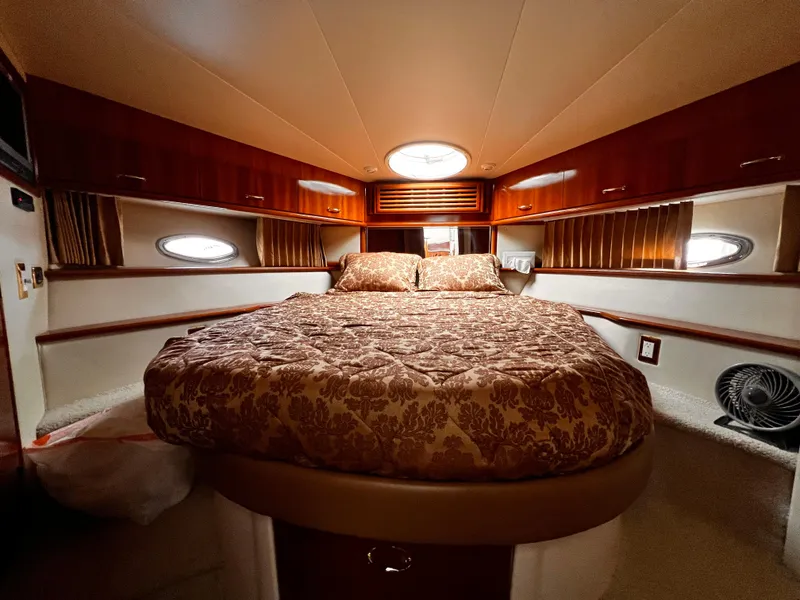 Slide: The Image of Luxurious bedroom interior of 2005 Carver 466 Motor Yacht with elegant bedding. - 13