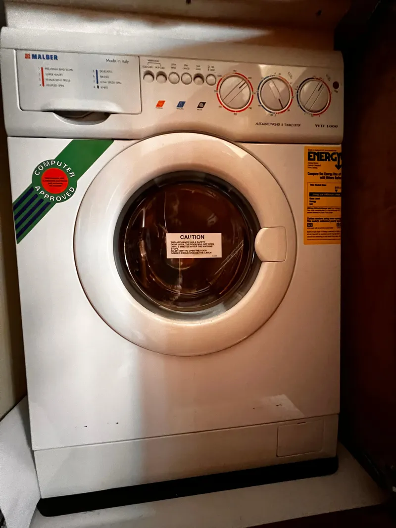 Slide: The Image of Front-loading Malber washing machine with control dials and energy efficiency label. - 17