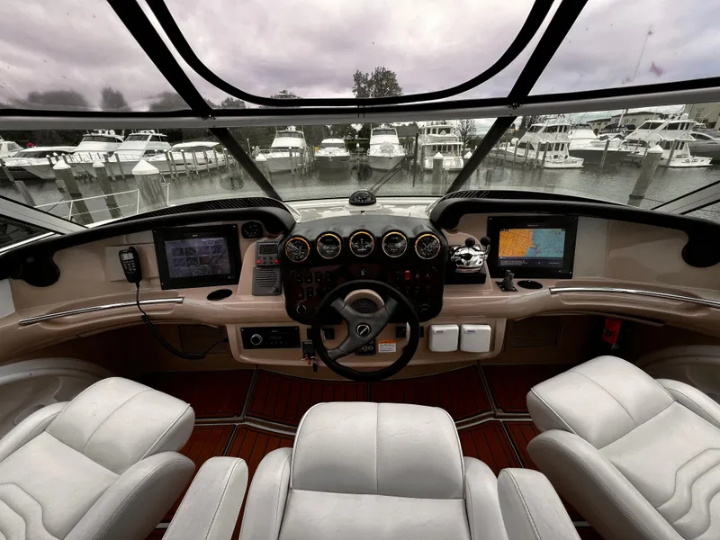 Slide: The Image of Interior cockpit of 2005 Carver 466 Motor Yacht with navigation equipment and leather seating. - 5