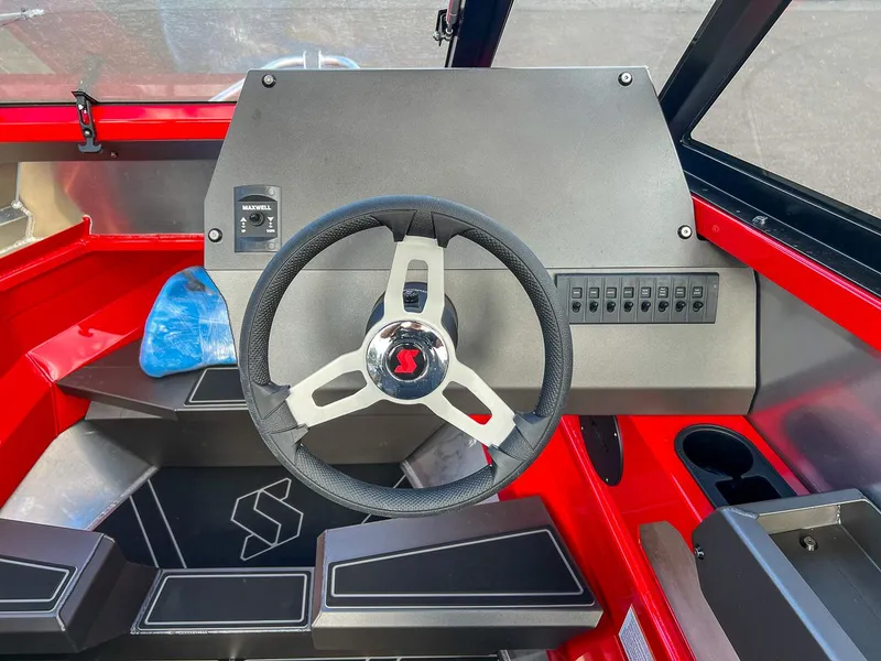Slide: The Image of 2025 Stabicraft 1850 Fisher dashboard with steering wheel and control panel. - 10
