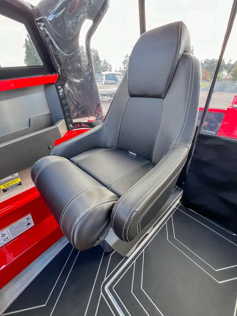 Slide: The Image of 2025 Stabicraft 1850 Fisher interior seat, black upholstery, modern design. - 11