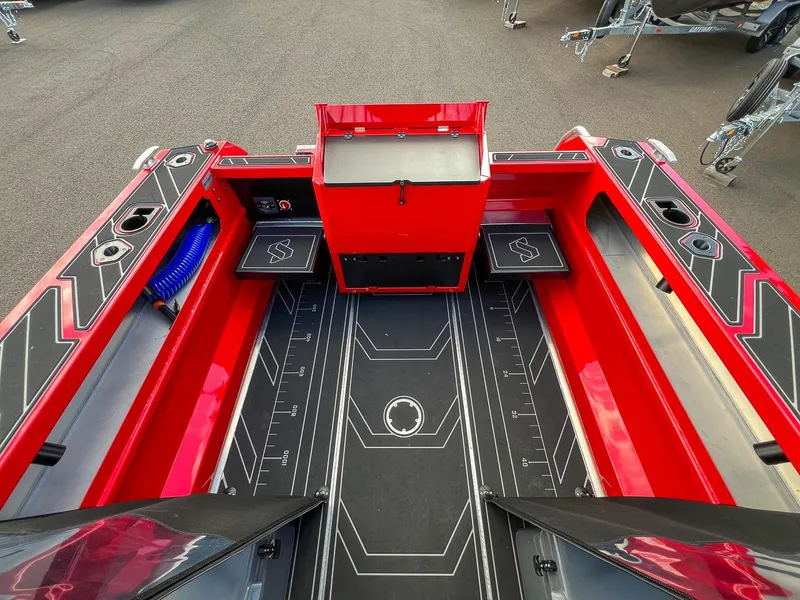 Slide: The Image of 2025 Stabicraft 1850 Fisher boat interior, featuring red and black design with storage compartments. - 16