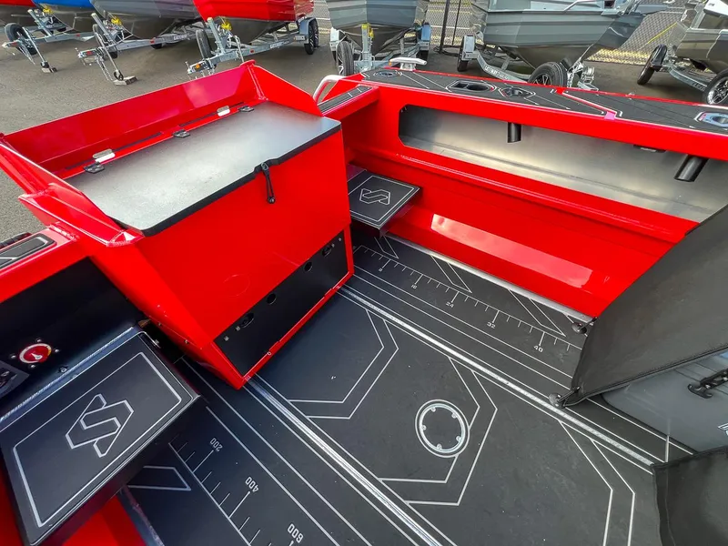 Slide: The Image of 2025 Stabicraft 1850 Fisher interior, featuring red accents and modern design elements. - 17