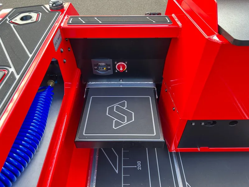 Slide: The Image of 2025 Stabicraft 1850 Fisher interior detail with red accents and control panel. - 20