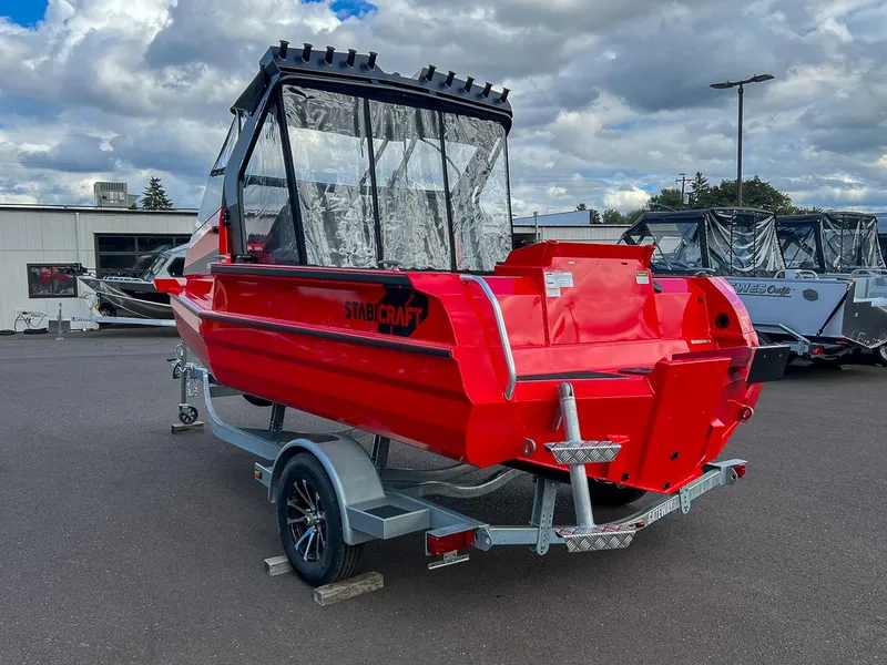 Slide: The Image of 2025 Stabicraft 1850 Fisher in vibrant red on a trailer, parked outdoors. - 5