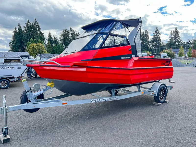 Slide: The Image of 2025 Stabicraft 1850 Fisher boat in vibrant red on a trailer, parked outdoors. - 6