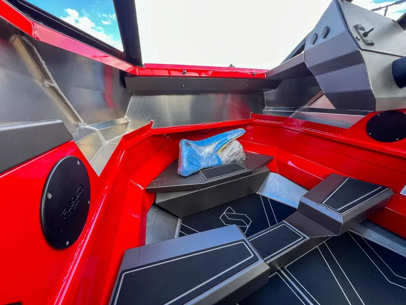 Slide: The Image of Interior of 2025 Stabicraft 1850 Fisher boat, featuring red and black design elements. - 9