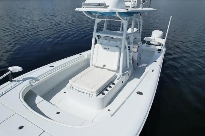 Slide: The Image of 2020 Costa Custom Boats 264 HC on calm water, showcasing sleek design and spacious deck. - 11