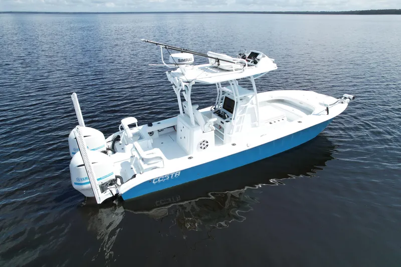 Slide: The Image of 2020 Costa Custom Boats 264 HC on calm water, featuring sleek design and modern equipment. - 2