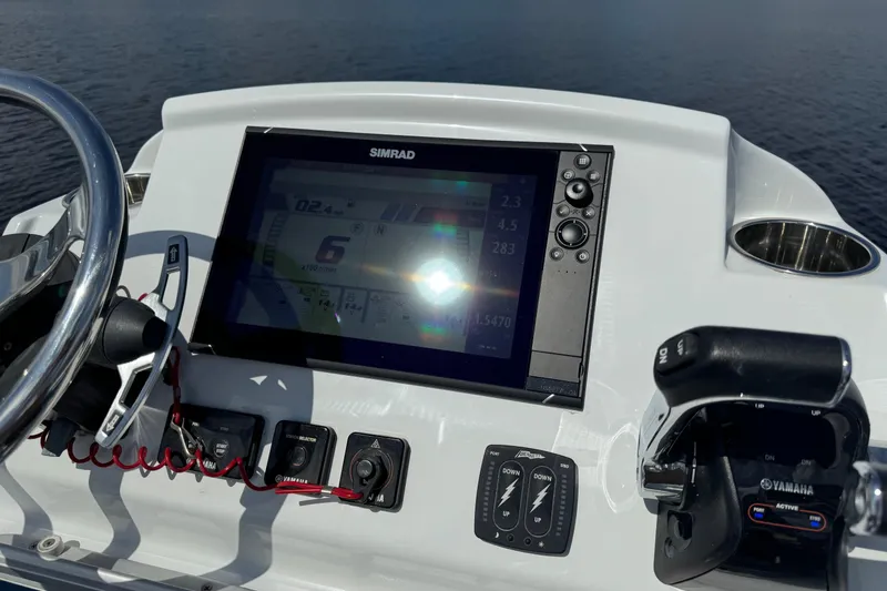 Slide: The Image of Control panel of 2020 Costa Custom Boats 264 HC with Simrad display and Yamaha throttle. - 23