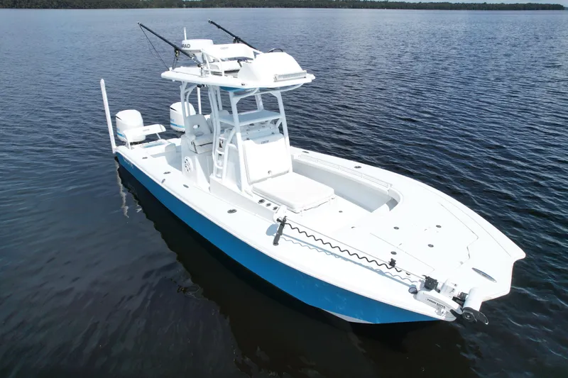 Slide: The Image of 2020 Costa Custom Boats 264 HC on calm water, featuring sleek design and fishing equipment. - 4