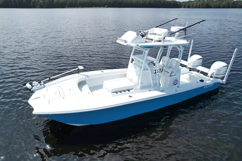 Slide: The Image of 2020 Costa Custom Boats 264 HC on calm water, featuring sleek design and fishing equipment. - 6