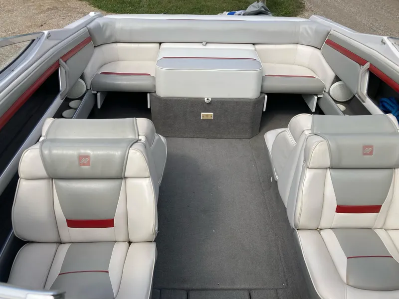 Slide: The Image of 1994 Four Winns 210 Horizon boat interior with gray and red seating. - 10