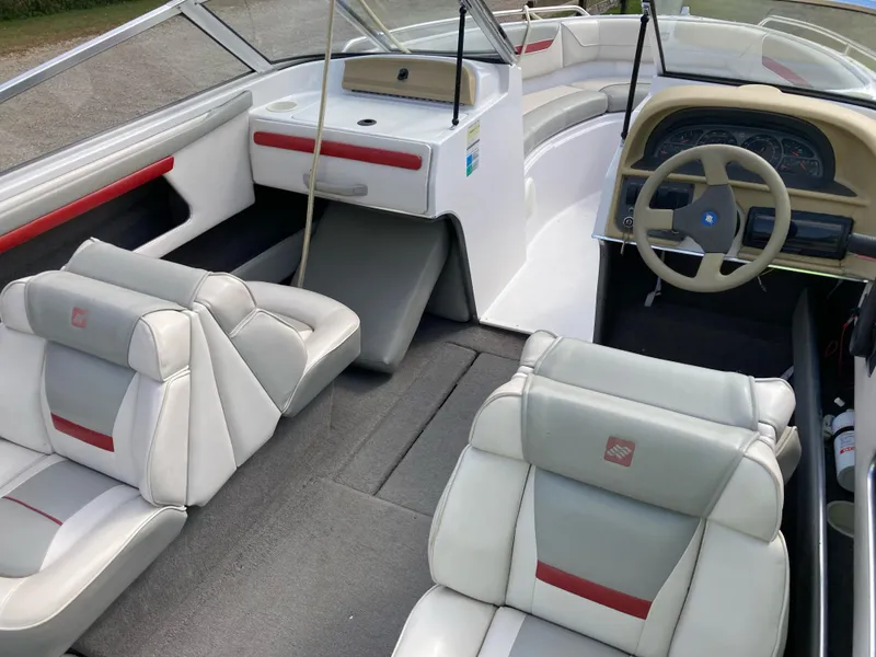 Slide: The Image of Interior of 1994 Four Winns 210 Horizon boat with white and red seating. - 11
