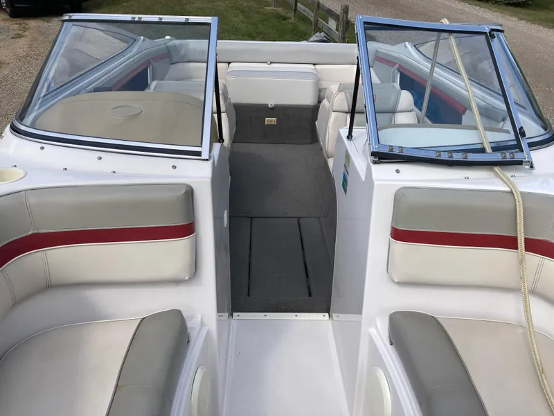 Slide: The Image of 1994 Four Winns 210 Horizon boat interior with white and red seating. - 12