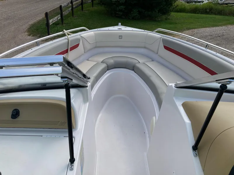 Slide: The Image of 1994 Four Winns 210 Horizon boat interior with white and red seating. - 7