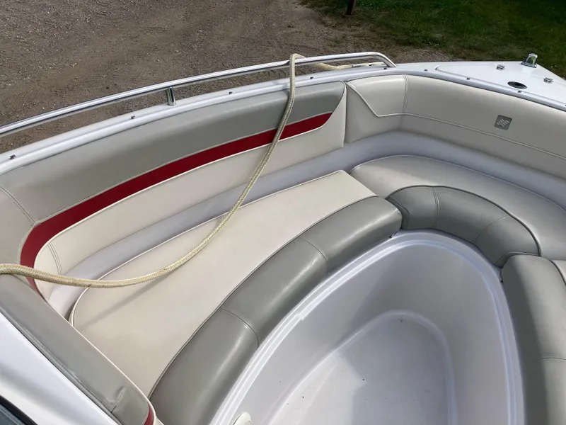 Slide: The Image of 1994 Four Winns 210 Horizon boat interior with red and gray seating. - 8
