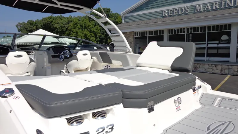 Slide: The Image of 2025 Chaparral 23 SSi boat at Reed's Marine, featuring sleek seating and modern design. - 10