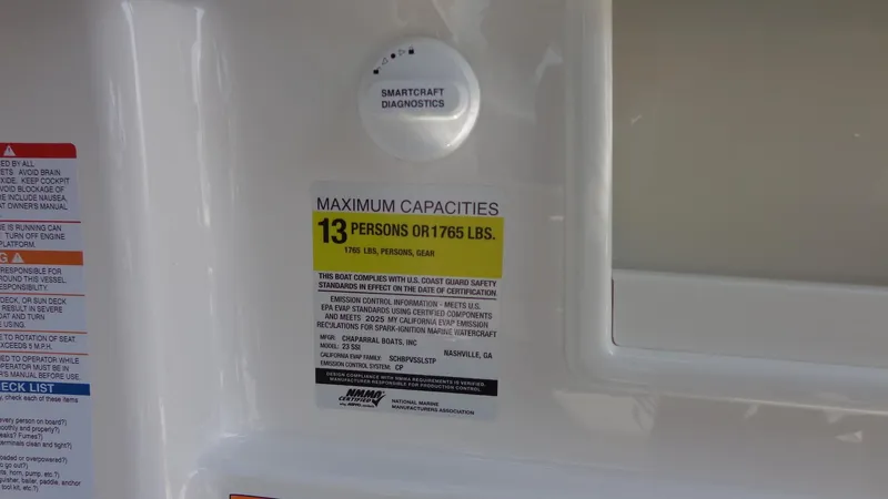Slide: The Image of 2025 Chaparral 23 SSi boat capacity label, maximum 13 persons or 1,765 lbs. - 16