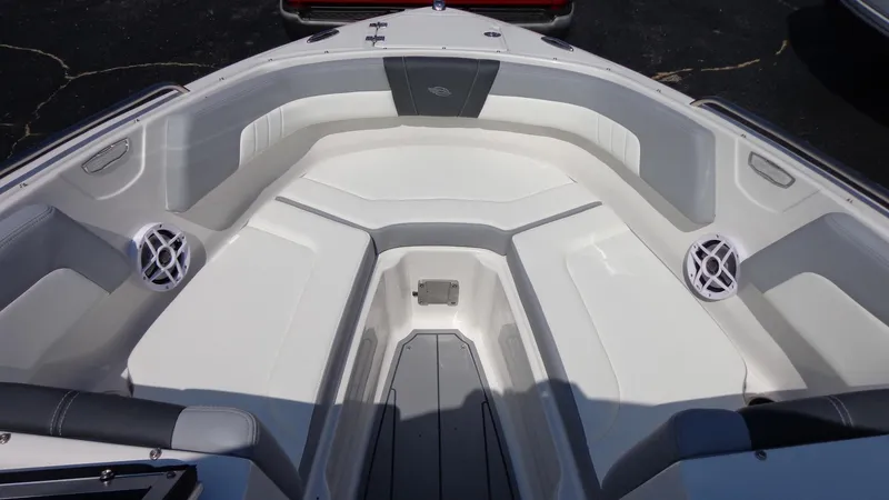 Slide: The Image of 2025 Chaparral 23 SSi boat interior with spacious seating and built-in speakers. - 21