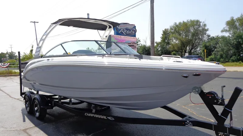 Slide: The Image of 2025 Chaparral 23 SSi boat on trailer, sleek design, outdoor display. - 3