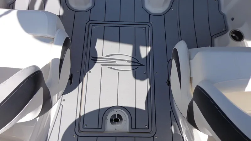 Slide: The Image of 2025 Chaparral 23 SSi boat interior with sleek seating and stylish flooring design. - 30